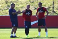BURTON-UPON-TRENT, ENGLAND - AUGUST 30:  Sam Allardyce (L), manager of England talks with Wayne Rooney and Harry Kane during an England training session at St George's Park on August 30, 2016 in Burton-upon-Trent, England.  (Photo by Matthew Lewis/Getty Images)